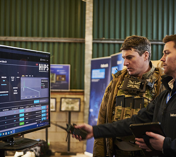 A member of the ˮAV˵ team demonstrates new training tool to an Army representative