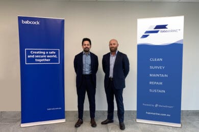 Representatives from ˮAV˵ and Franmarine standing in front of company banners